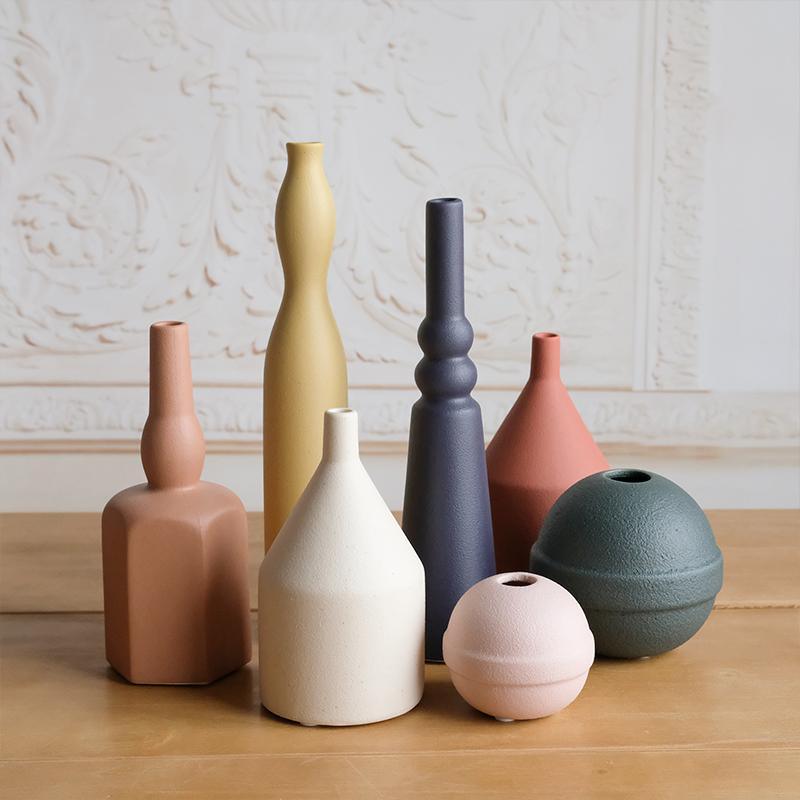 A Set Of Seven Vases